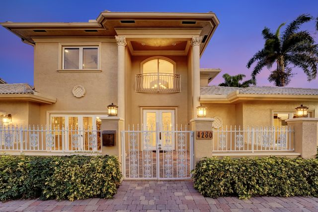 a kitchen with stainless steel appliances granite countertop a refrigerator and a stove