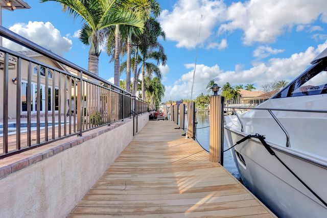 a bathroom with a granite countertop sink mirror and shower