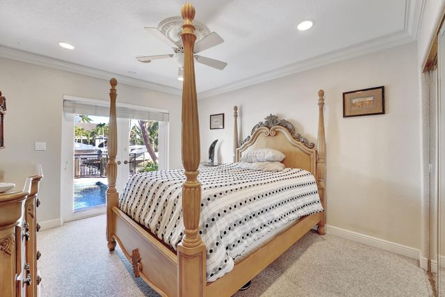 a living room with furniture a rug and a dining table