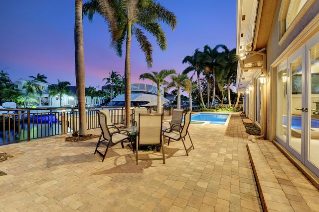 a front view of a house with a garden and a yard