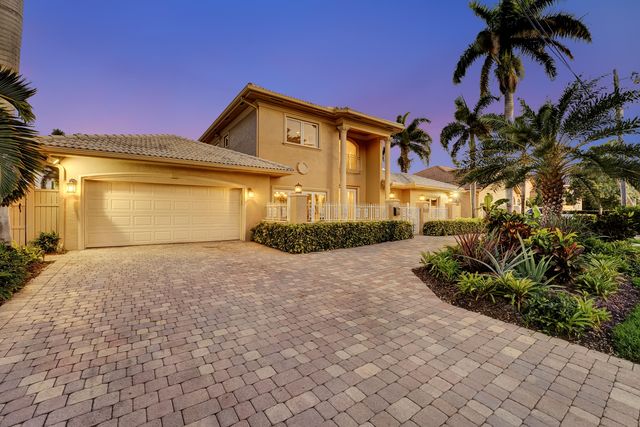 a outdoor space with a large window and furniture