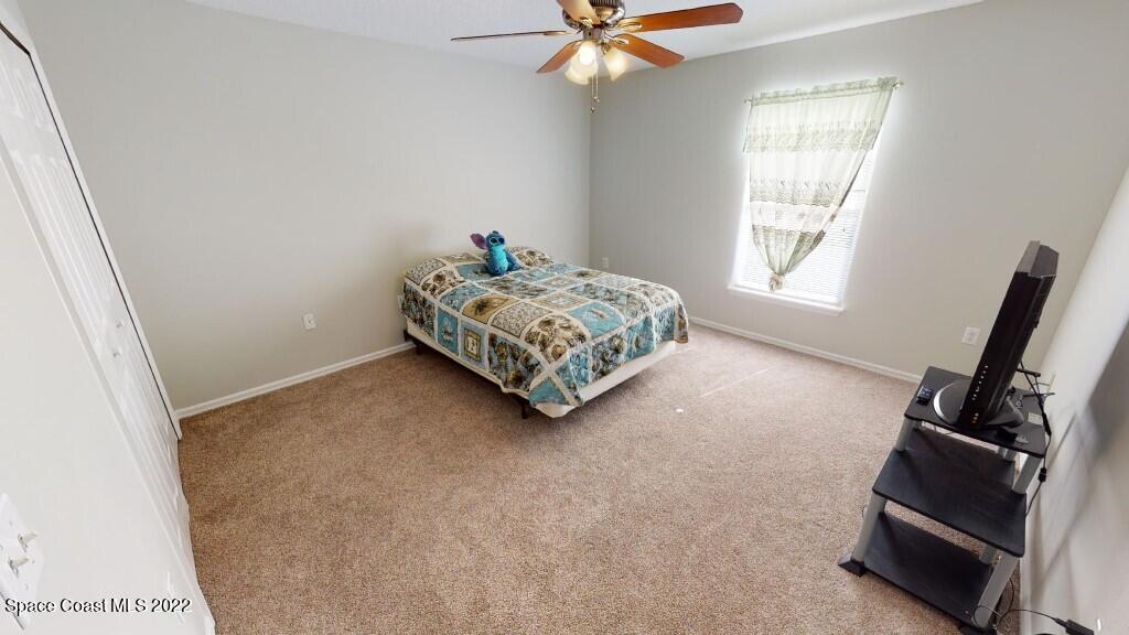 2343 Angel Road Palm Bay, FL 32909 - Photo 19 of 28 a living room with furniture and a window