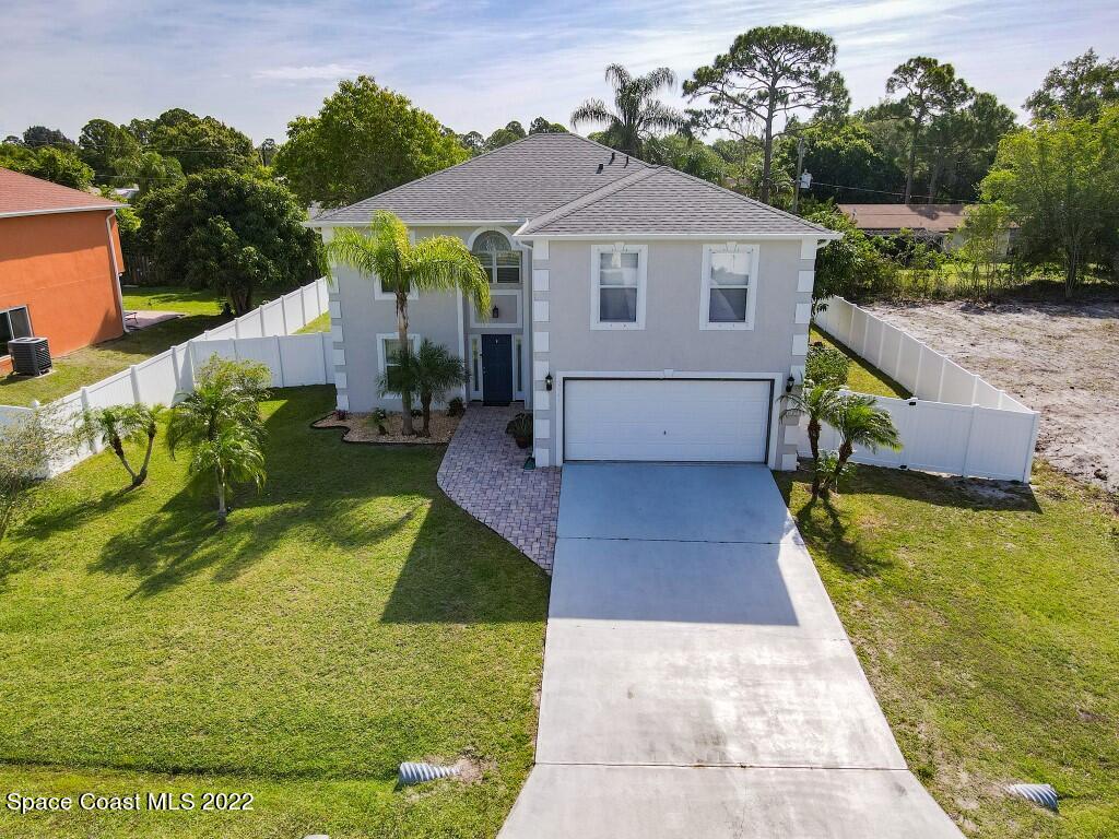 2343 Angel Road Palm Bay, FL 32909 - Photo 26 of 28 a view of house with garden space and swimming pool