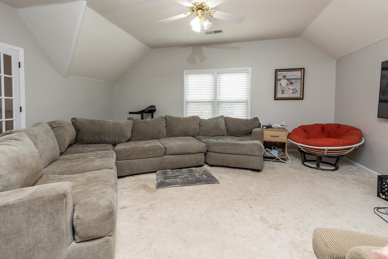 982 Handforth Cove Collierville, TN 38017 - Photo 20 of 25 a living room with furniture a rug and a window