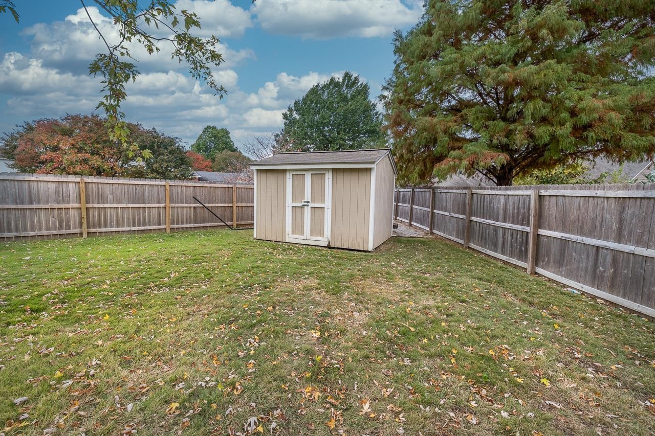 982 Handforth Cove Collierville, TN 38017 - Photo 22 of 25 a view of a backyard with a small cabin
