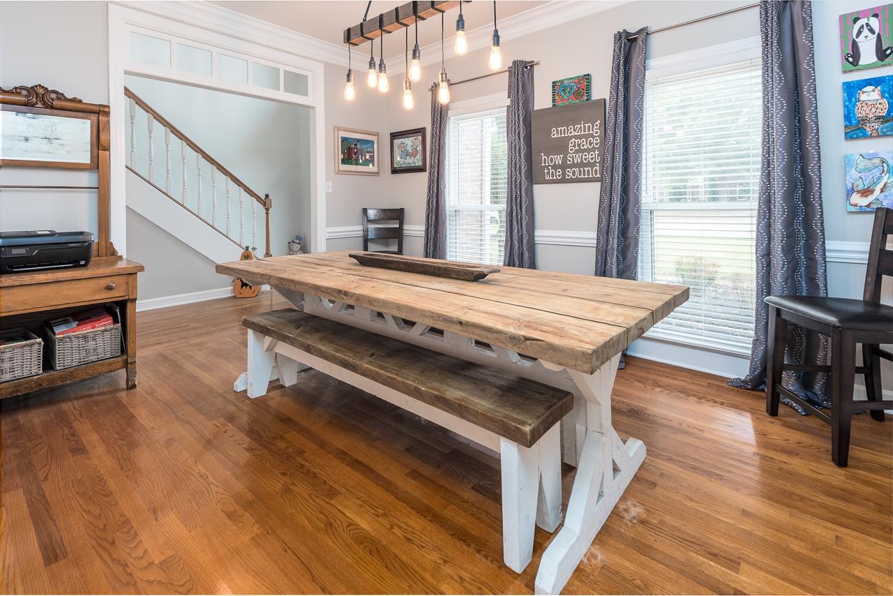 982 Handforth Cove Collierville, TN 38017 - Photo 4 of 25 a bed room with a bed and a chandelier