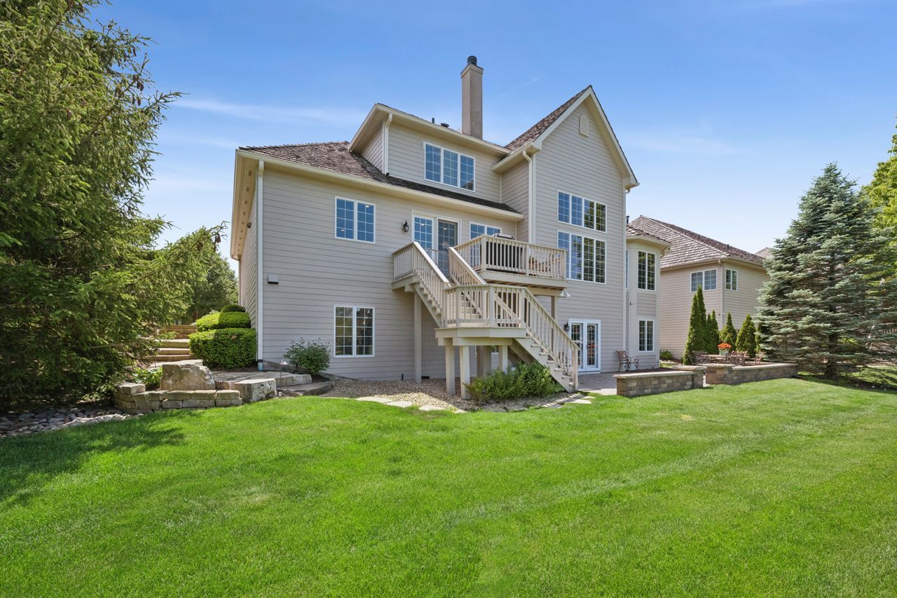 1029 Ridgeview Drive Inverness, IL 60010 - Photo 50 of 58 a front view of house with a garden and deck