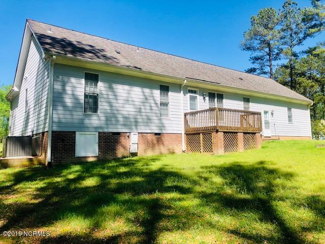 3812 Pecan Grove Road Zebulon, NC 27597 - Photo 2 of 21 Back view of the beautiful yard!