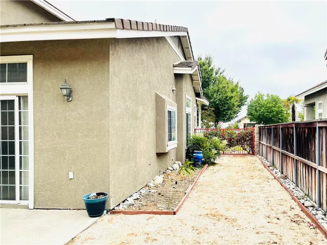 a view of a house with wooden floor and a garage