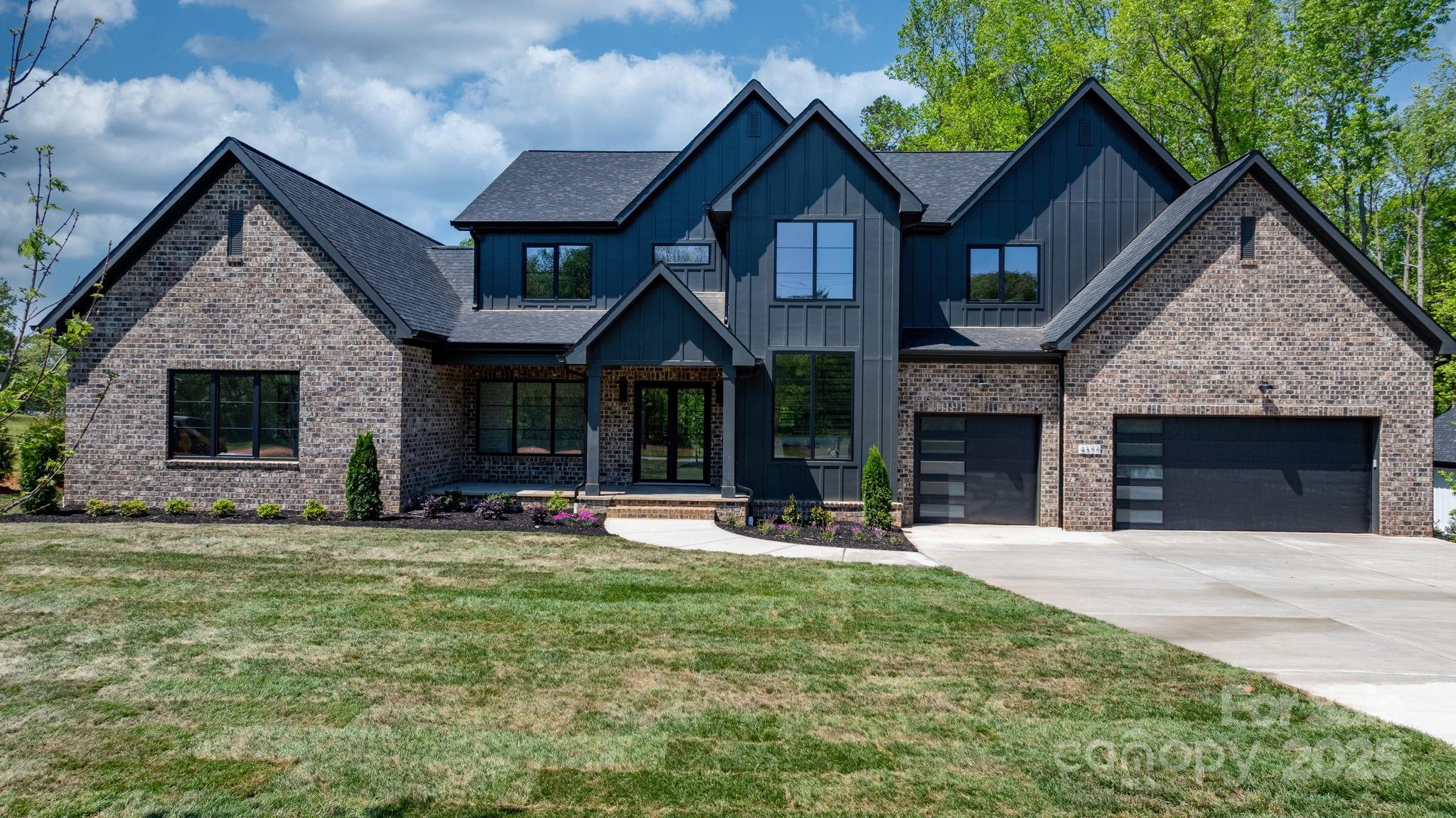 4377 Kiser Island Road Terrell, NC 28682 - Photo 2 of 47 a front view of a house with a yard and outdoor seating