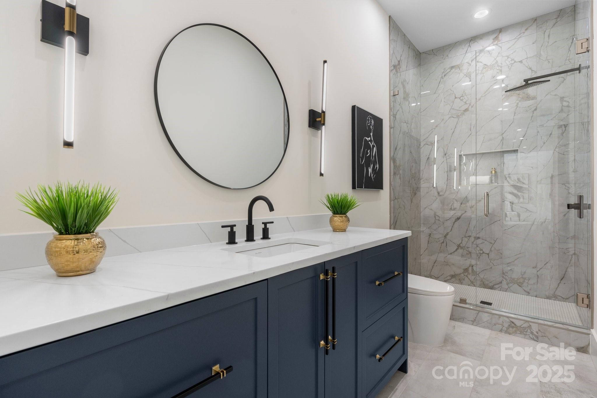 4377 Kiser Island Road Terrell, NC 28682 - Photo 25 of 47 a bathroom with a sink a toilet and a mirror