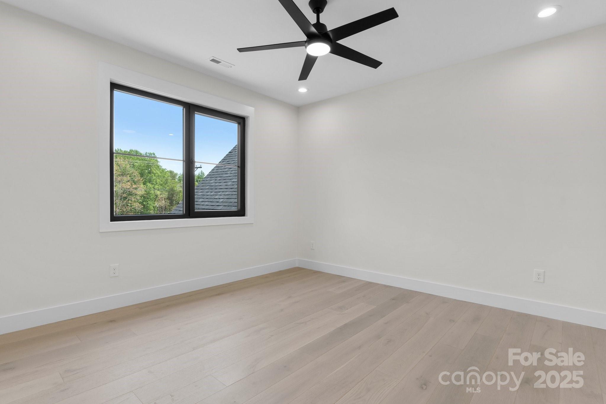 4377 Kiser Island Road Terrell, NC 28682 - Photo 36 of 47 an empty room with a window and a ceiling fan