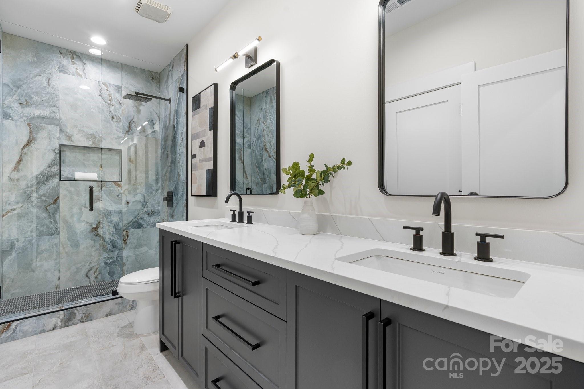 4377 Kiser Island Road Terrell, NC 28682 - Photo 44 of 47 a bathroom with a double vanity sink mirror double shower and a toilet