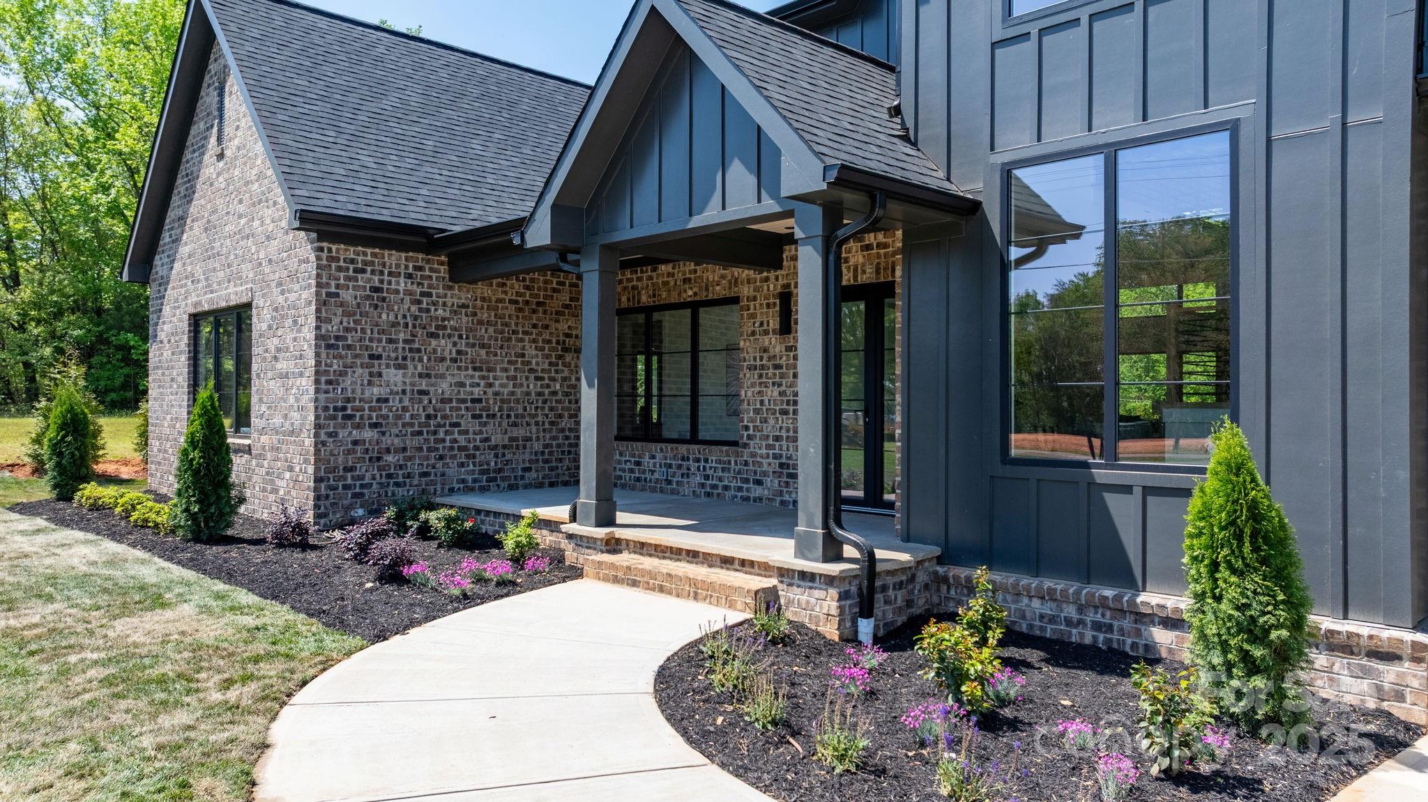 4377 Kiser Island Road Terrell, NC 28682 - Photo 5 of 47 a front view of a house with garden