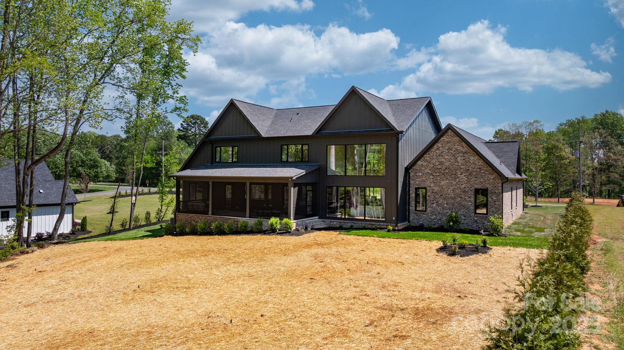 4377 Kiser Island Road Terrell, NC 28682 - Photo 9 of 47 a front view of house with yard outdoor seating and barbeque oven
