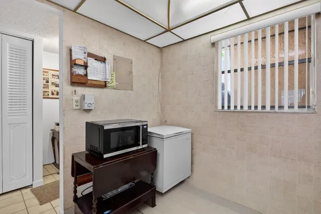 a kitchen with cabinets and appliances