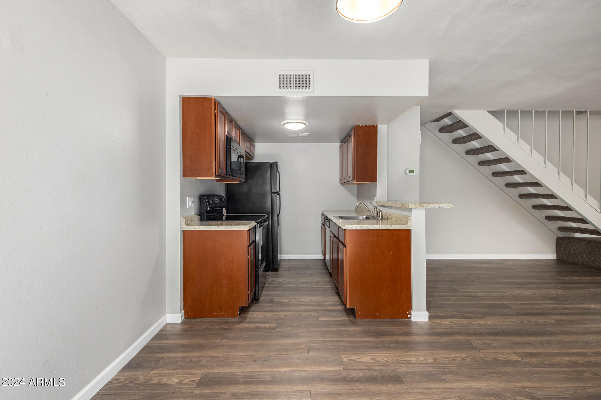 17034 East Calle Del Oro, Unit C Fountain Hills, AZ 85268 - Photo 11 of 22 a view of kitchen and hall with wooden floor