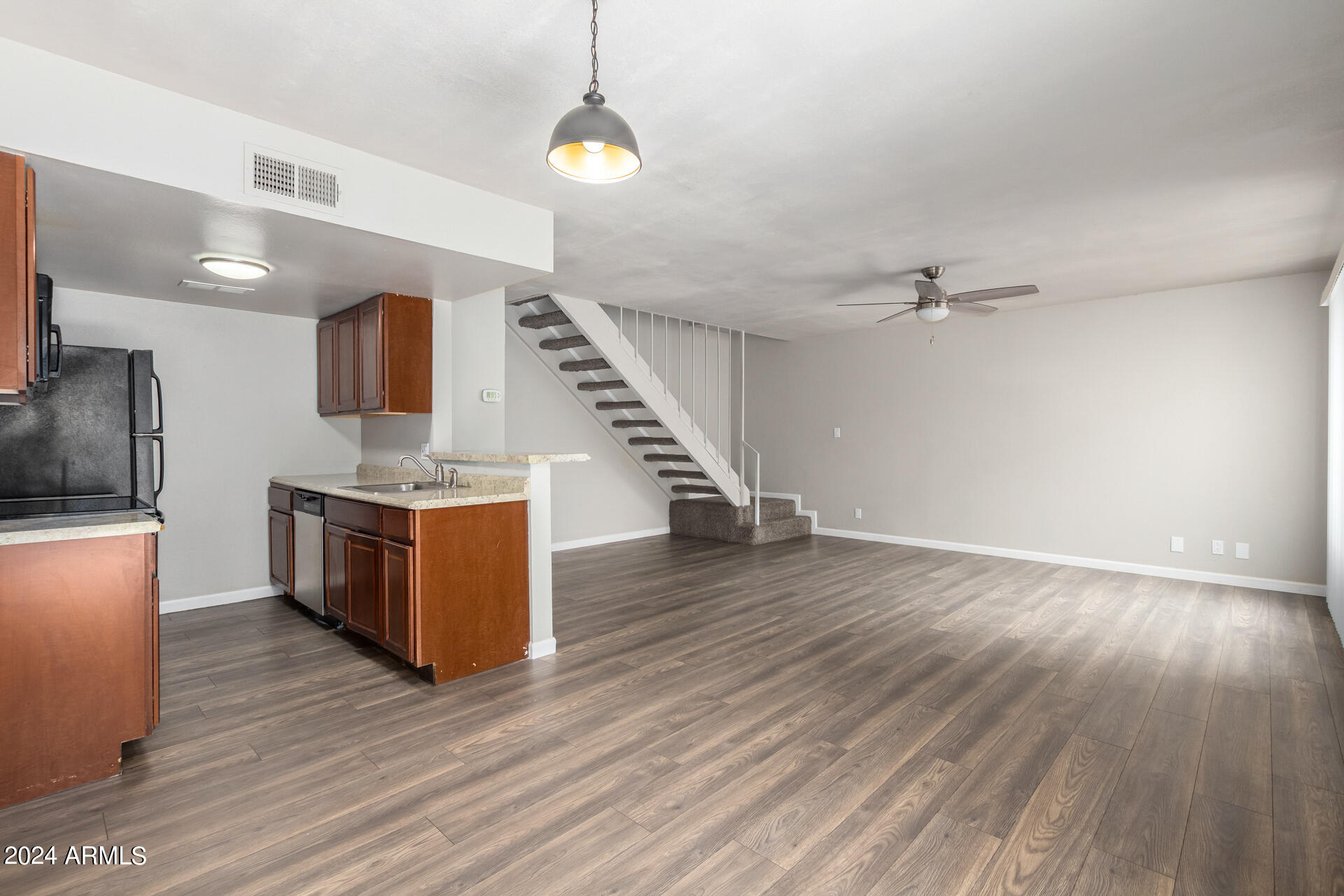 17034 East Calle Del Oro, Unit C Fountain Hills, AZ 85268 - Photo 12 of 22 a view of kitchen and hall with wooden floor