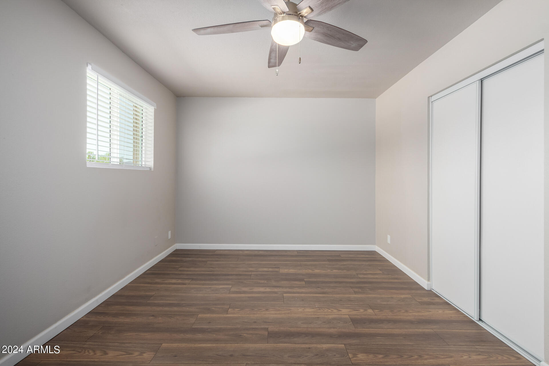17034 East Calle Del Oro, Unit C Fountain Hills, AZ 85268 - Photo 16 of 22 wooden floor in an empty room with a window