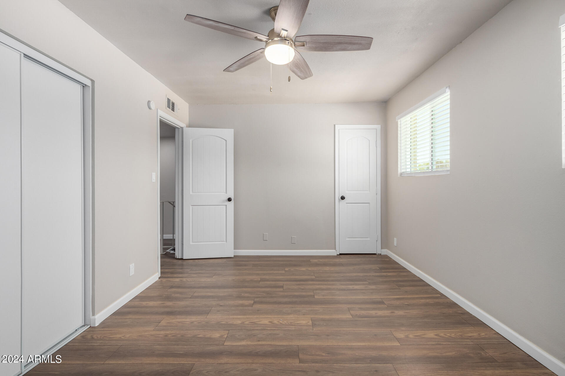 17034 East Calle Del Oro, Unit C Fountain Hills, AZ 85268 - Photo 17 of 22 a view of an empty room with a ceiling fan