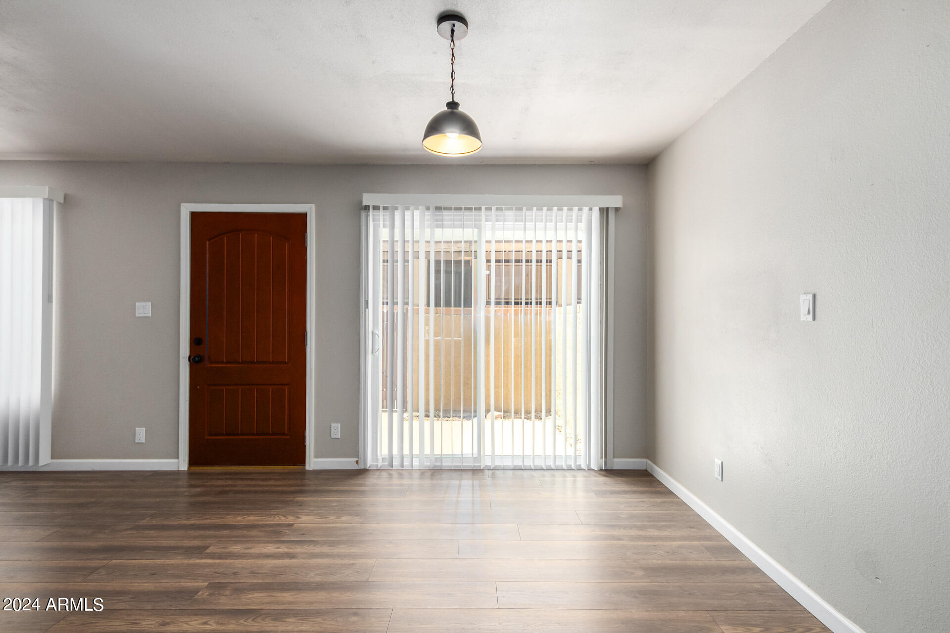 17034 East Calle Del Oro, Unit C Fountain Hills, AZ 85268 - Photo 6 of 22 a view of a room with wooden floor and windows