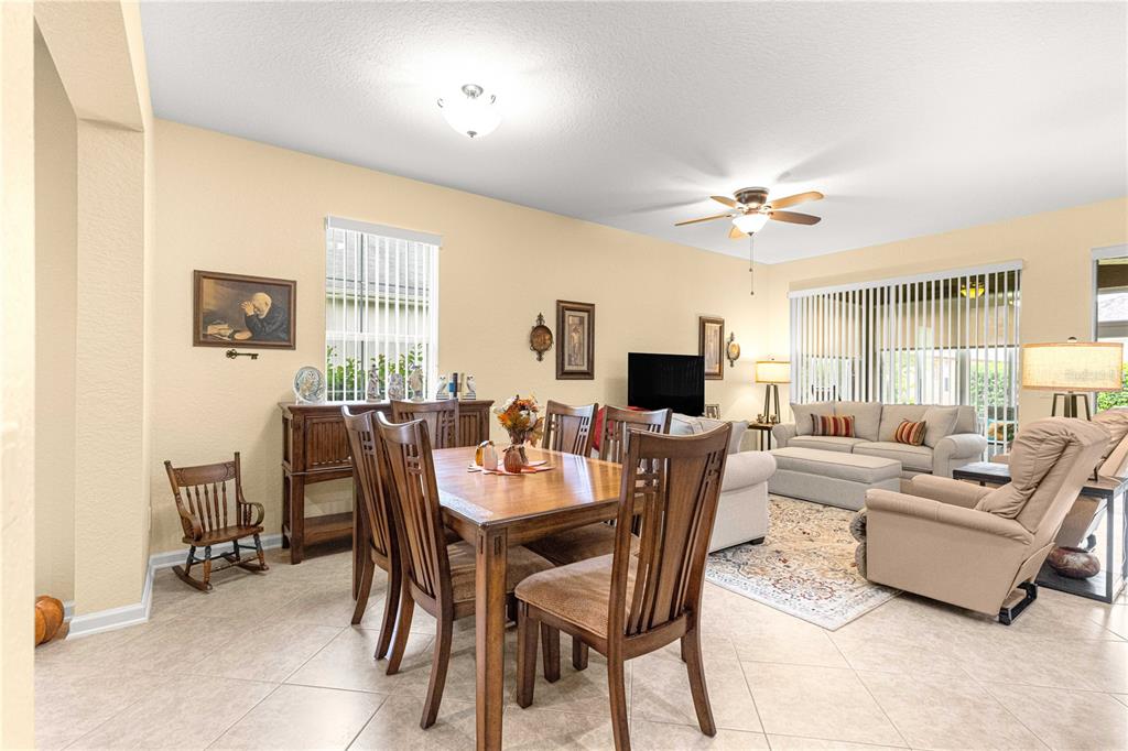 9566 Southwest 70th Loop Ocala, FL 34481 - Photo 13 of 53 a view of a dining room with furniture