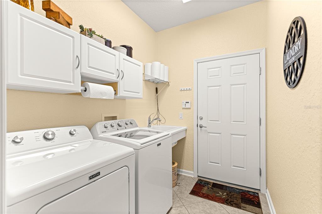 9566 Southwest 70th Loop Ocala, FL 34481 - Photo 29 of 53 a utility room with dryer and washer