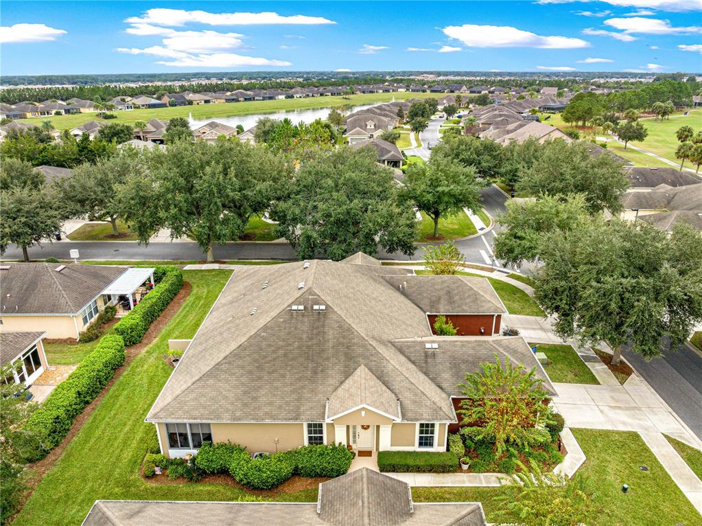9566 Southwest 70th Loop Ocala, FL 34481 - Photo 45 of 53 an aerial view of residential houses with outdoor space and ocean view