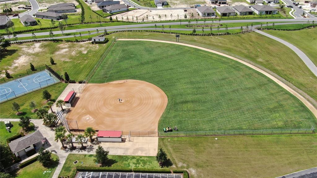 9566 Southwest 70th Loop Ocala, FL 34481 - Photo 50 of 53 an aerial view of a house with a lake view