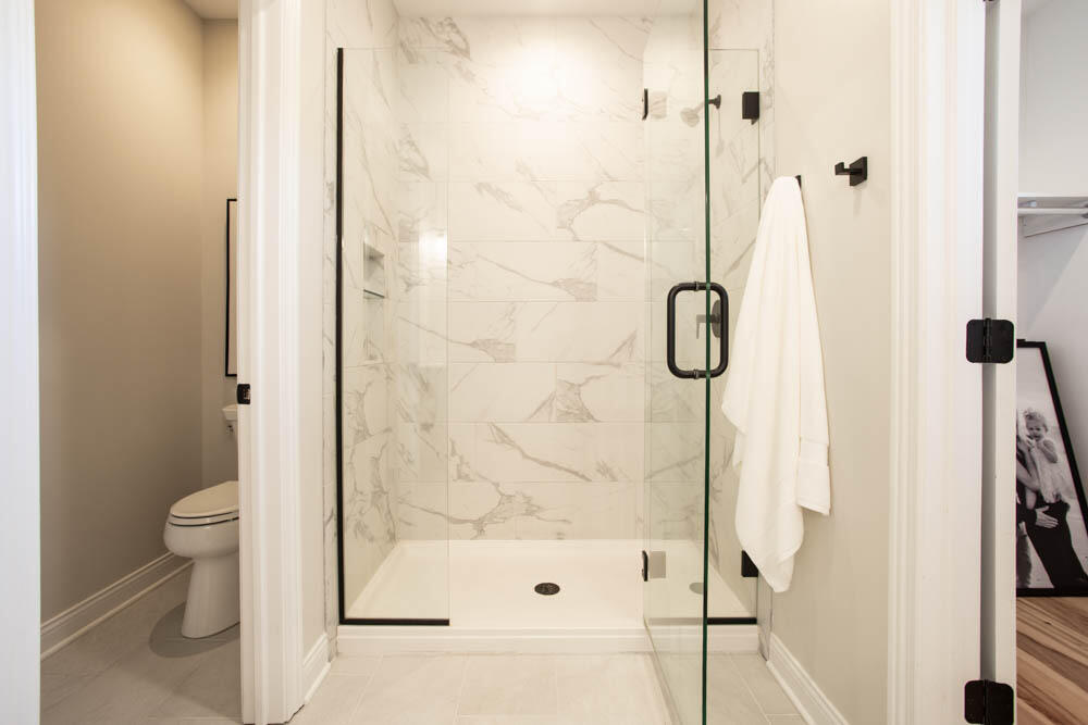 7264 East 115th Avenue Crown Point, IN 46307 - Photo 14 of 42 a bathroom with a shower toilet and sink