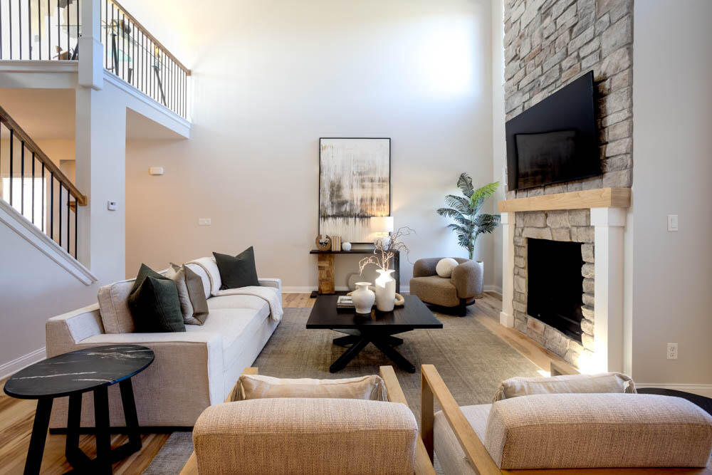 7264 East 115th Avenue Crown Point, IN 46307 - Photo 19 of 42 a living room with furniture a flat screen tv and a fireplace