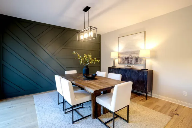 a dining room with furniture and window