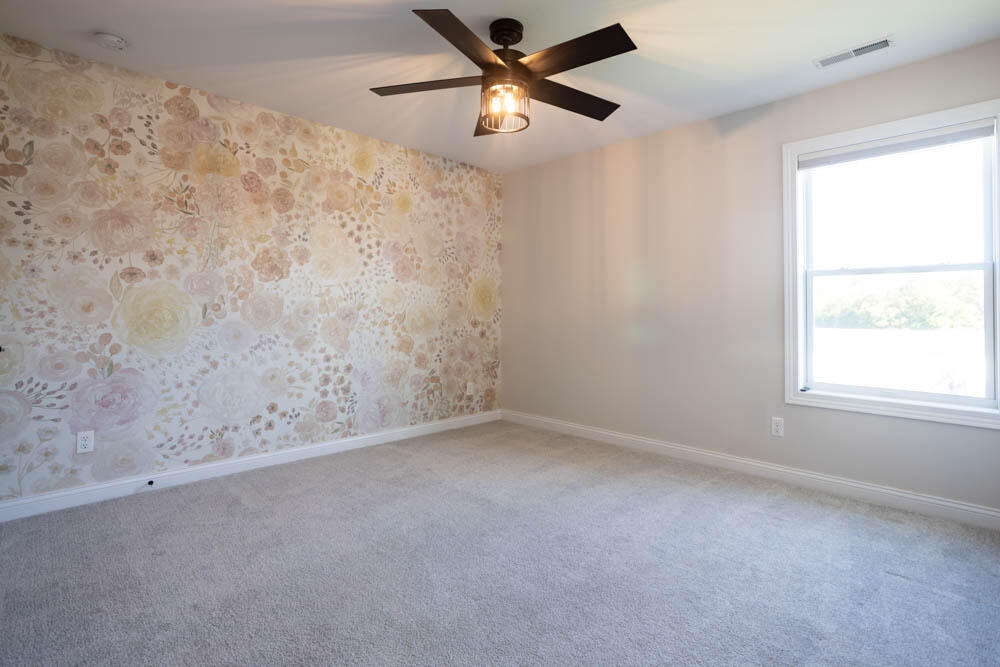 7264 East 115th Avenue Crown Point, IN 46307 - Photo 30 of 42 an empty room with a window and a fan