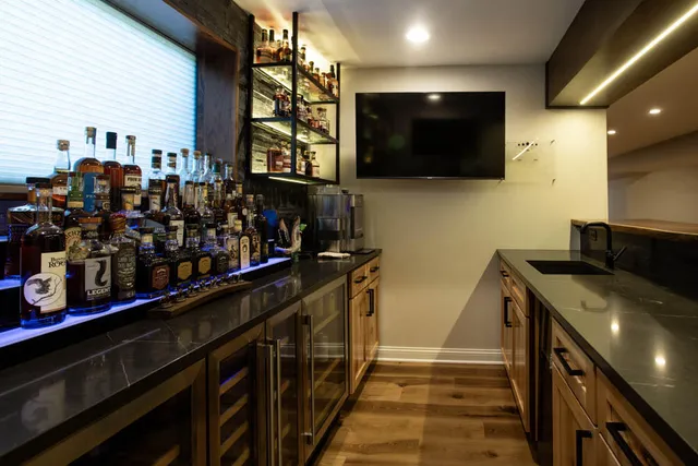 a kitchen with stainless steel appliances granite countertop a sink and a stove