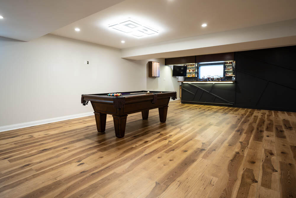 7264 East 115th Avenue Crown Point, IN 46307 - Photo 37 of 42 a view of a room with kitchen island stainless steel appliances wooden floor and window