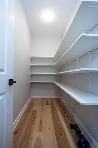 a storage room with wooden floor