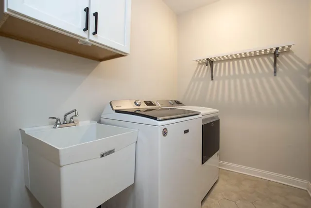 a utility room with dryer and washer