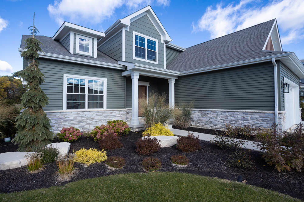 7264 East 115th Avenue Crown Point, IN 46307 - Photo 4 of 42 a front view of a house with a yard