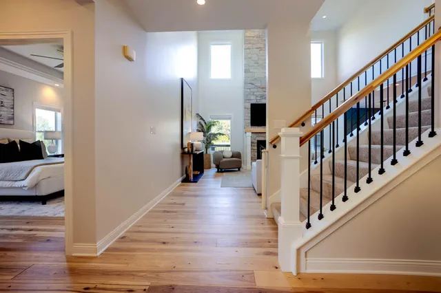 a view of a livingroom with furniture and stairs