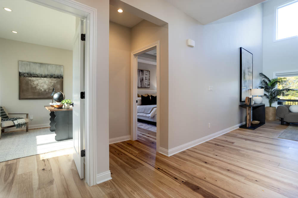 7264 East 115th Avenue Crown Point, IN 46307 - Photo 9 of 42 a view of a hallway view with wooden floor and furniture