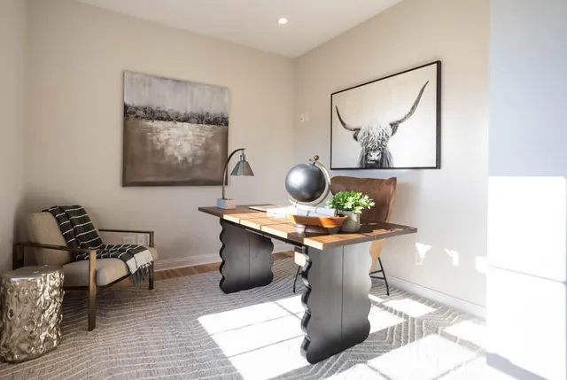 a view of a living room and dining room with furniture