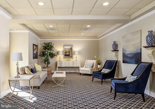 a living room with a flat screen tv and a fireplace