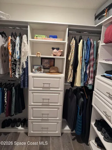 a bathroom with a granite countertop sink a toilet and a mirror