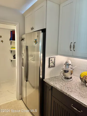 a view of a dining room and livingroom with furniture