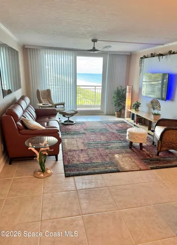 a bedroom with two beds and a lamp