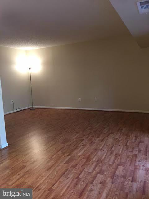 11650 Stoneview Square, Unit 1B Reston, VA 20191 - Photo 8 of 17 Living Room w/new flooring