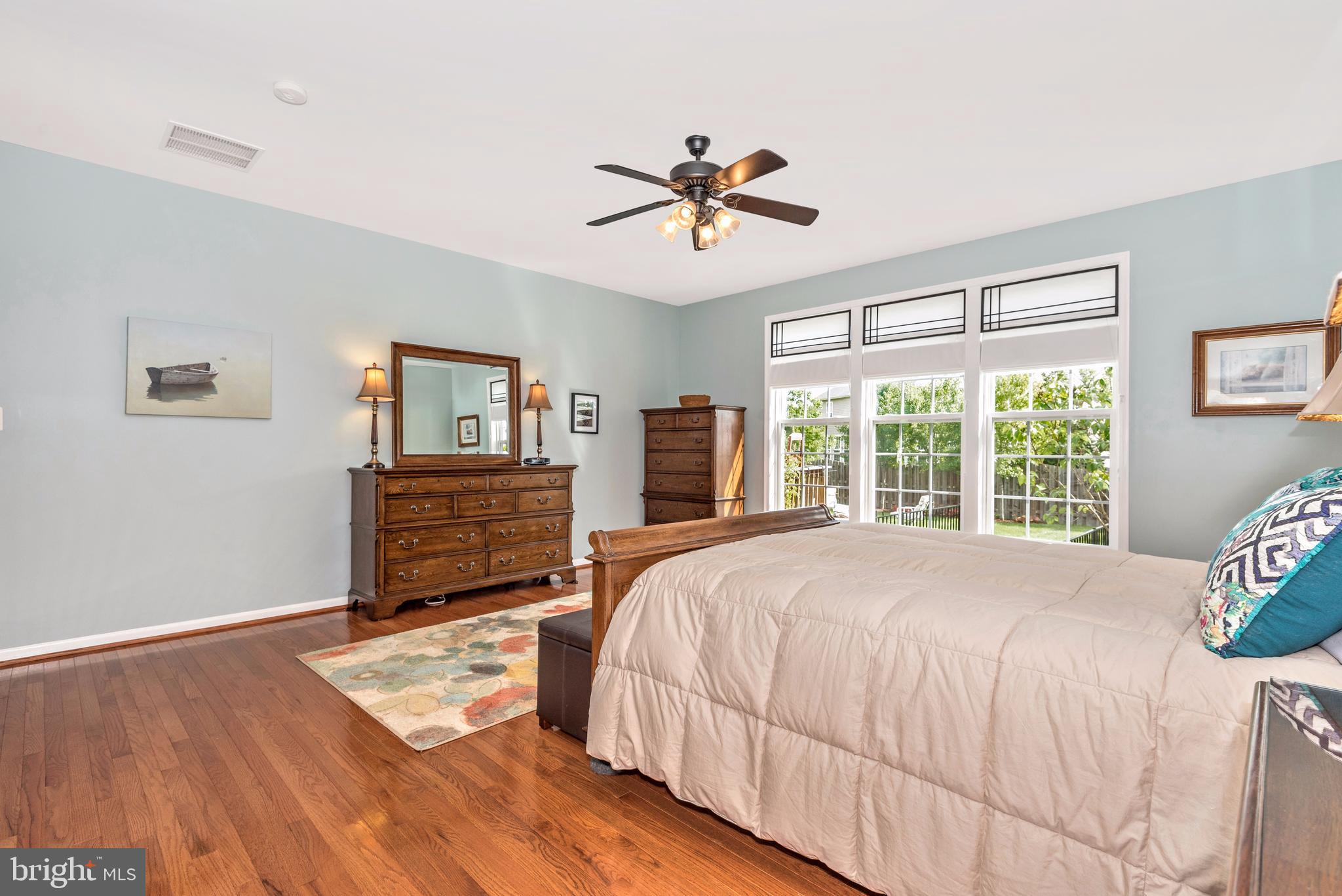 1713 Canal Run Drive Point of Rocks, MD 21777 - Photo 11 of 38 a bedroom with a bed a chandelier and a window