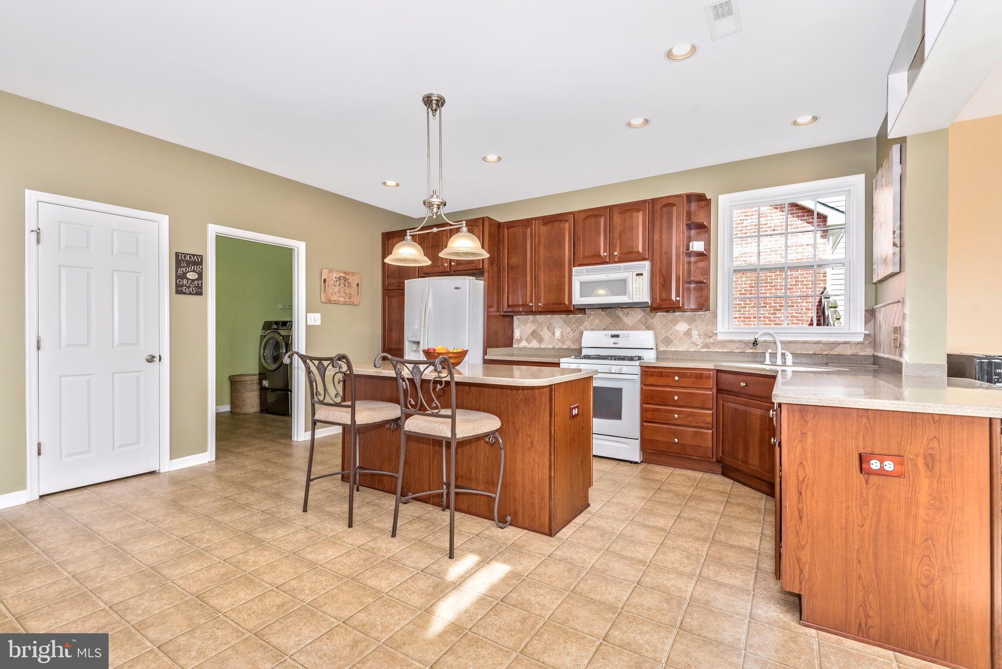 1713 Canal Run Drive Point of Rocks, MD 21777 - Photo 21 of 38 a large kitchen with a table and chairs