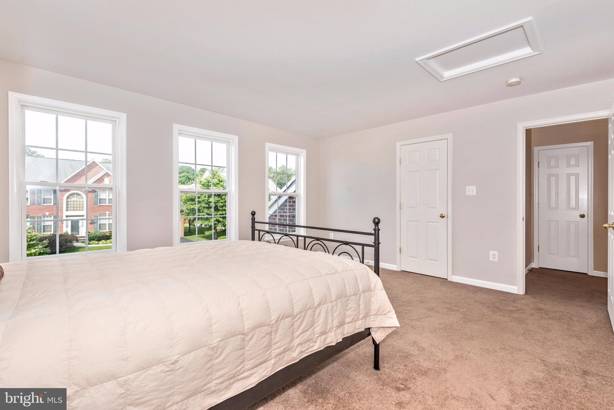 1713 Canal Run Drive Point of Rocks, MD 21777 - Photo 26 of 38 a spacious bedroom with a bed and a large window