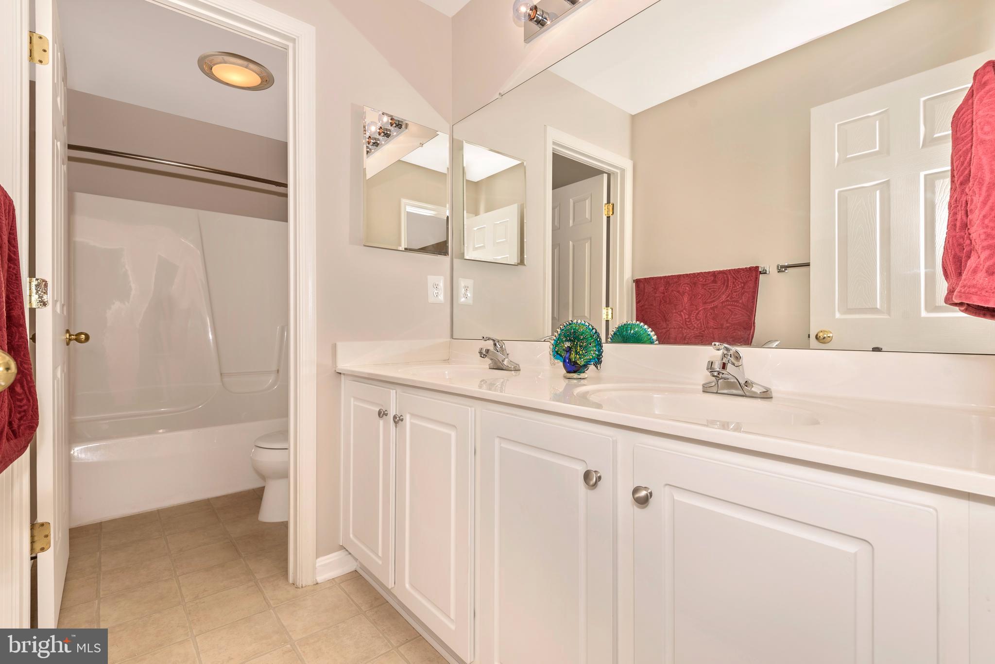 1713 Canal Run Drive Point of Rocks, MD 21777 - Photo 30 of 38 a bathroom with a granite countertop sink and a mirror